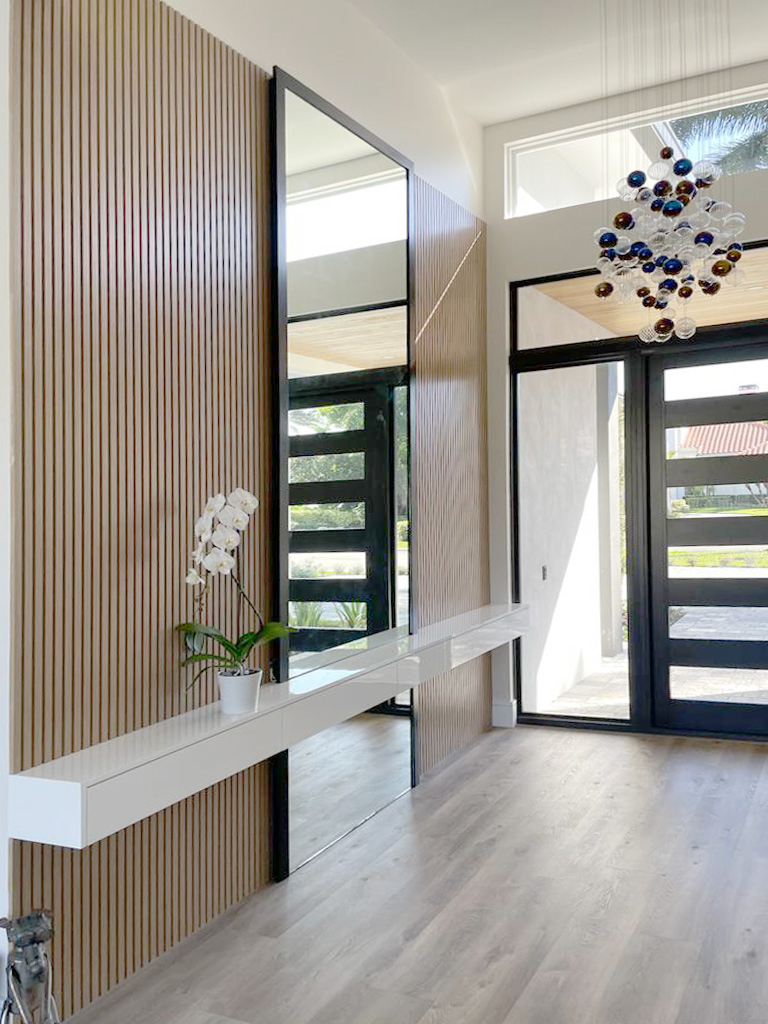Entryway with natural wood slat feature wall