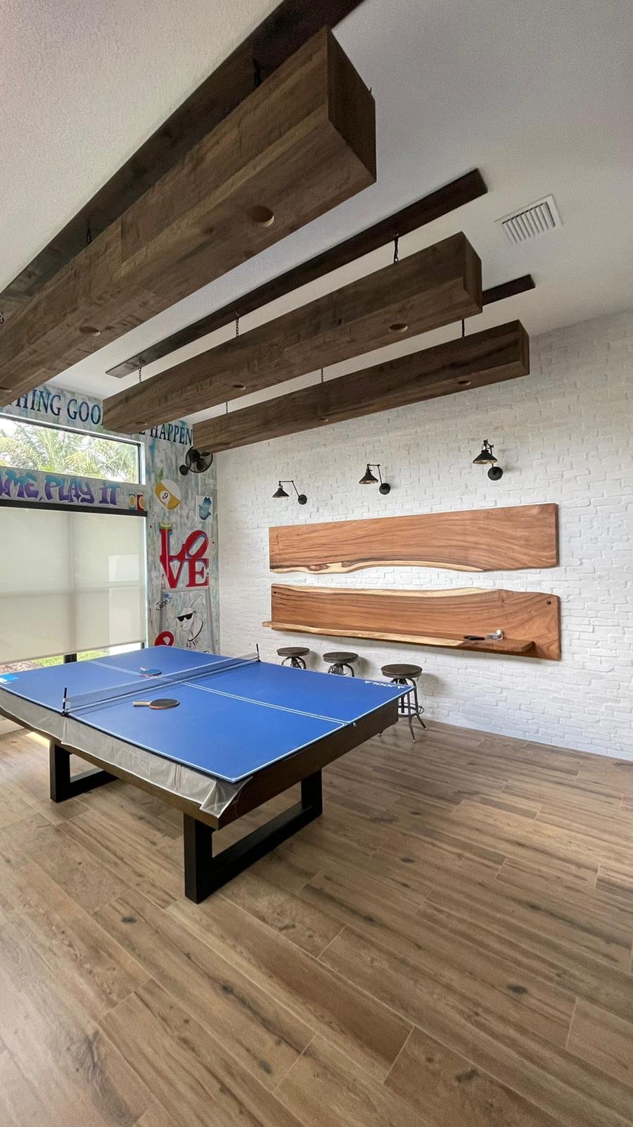 Custom wood ceiling beams in entertainment room
